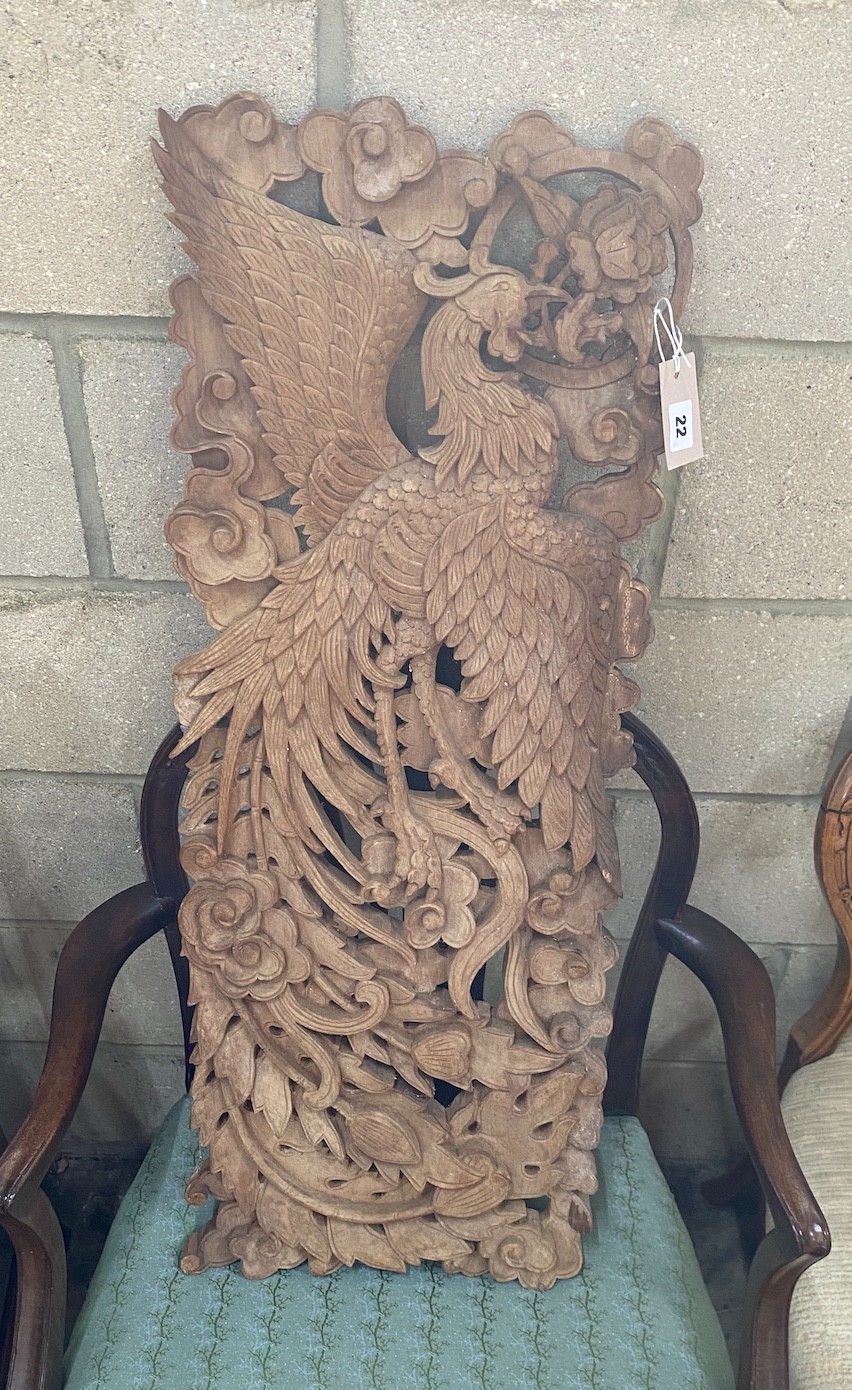 A South East Asian carved wood panel, width 34cm, height 92cm